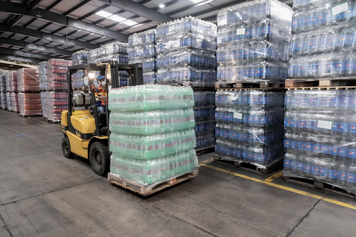 Forklift with pallets in a logistics warehouse