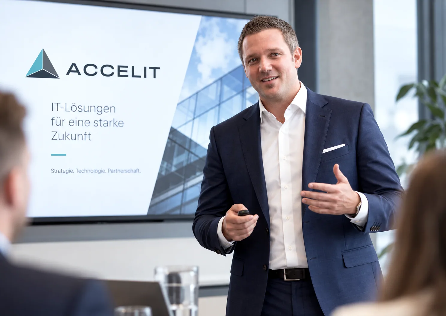AI-edited image: Vitus Holzner, Managing Director of Accelit, presenting in a meeting